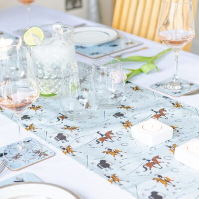 Dressage Horse table runner. Set up on a table with matching placemats and coasters.