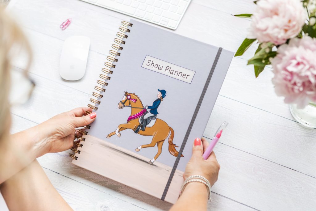 A4 Horse show planner book by Emily Cole Illustrations with grey elastic and chestnut horse illustration