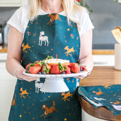 100% Cotton Apron in Teal. Featuring a Dog design, including a Collie, Dalmatian and Terrier Dogs.